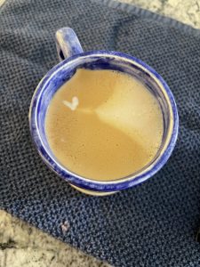 Coffee cup with tiny foam heart
