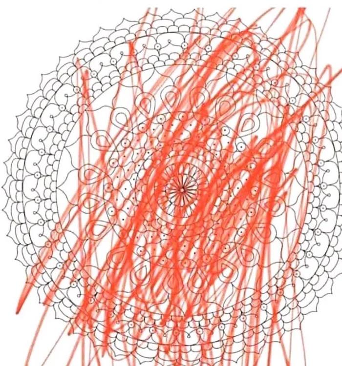 An intricate mandala coloring page with orange scribbles all over it instead of being colored in neatly